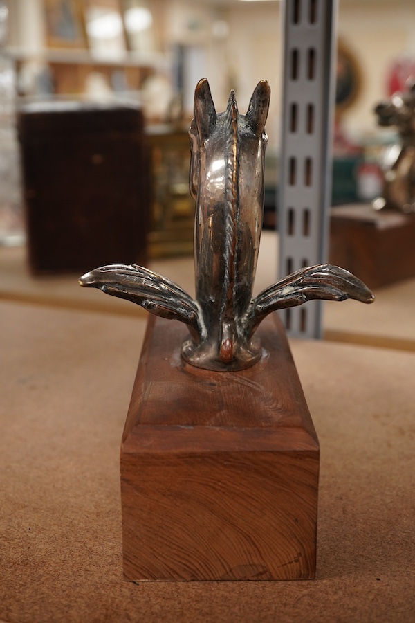 A silver plated Pegasus horse's head car mascot, signed D.G. Yeo, dated 1924, mounted on a wooden plinth